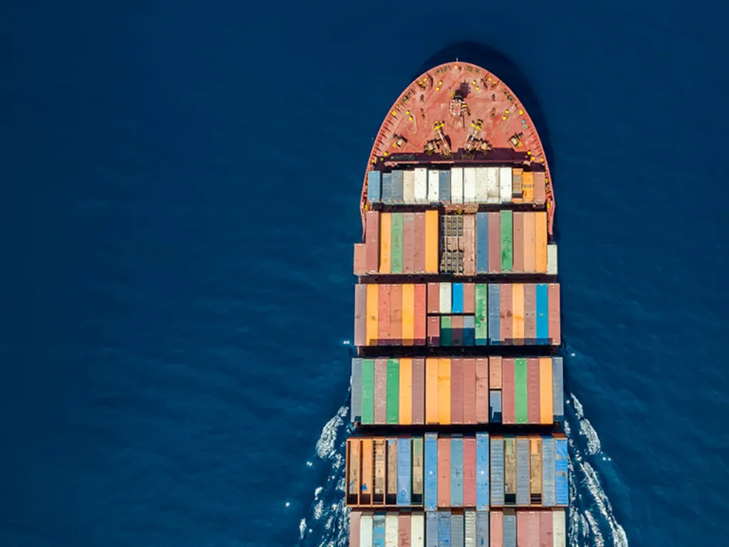 Aerial view of a container ship loaded with shipping containers