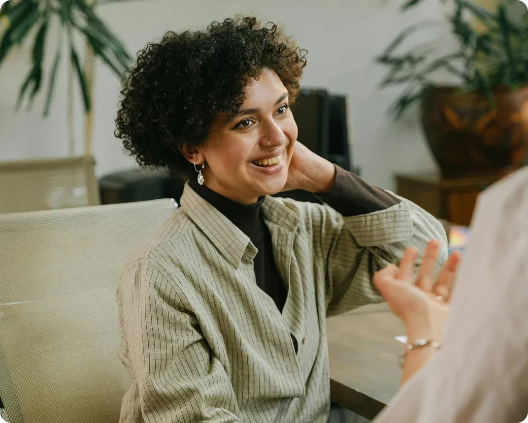 Consultant smiling during a client meeting